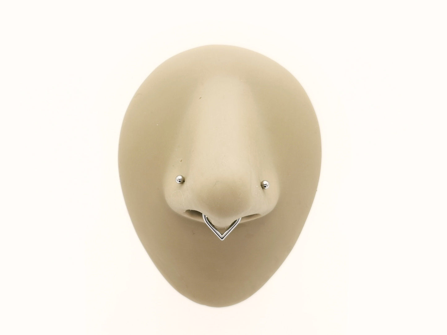 a titanium wishbone clicker worn on a mannequin