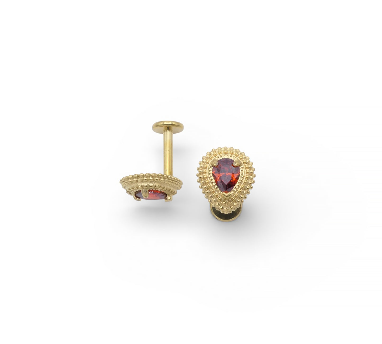 Gold earrings with gemstones on a white background