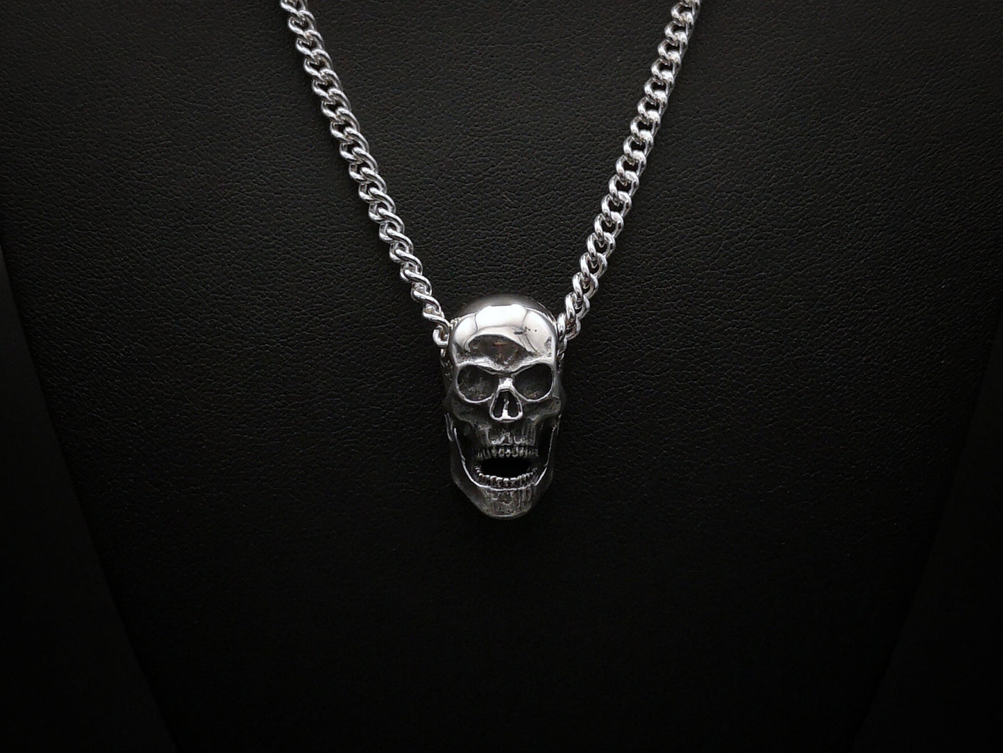 Large silver skull pendant necklace with silver curb chain