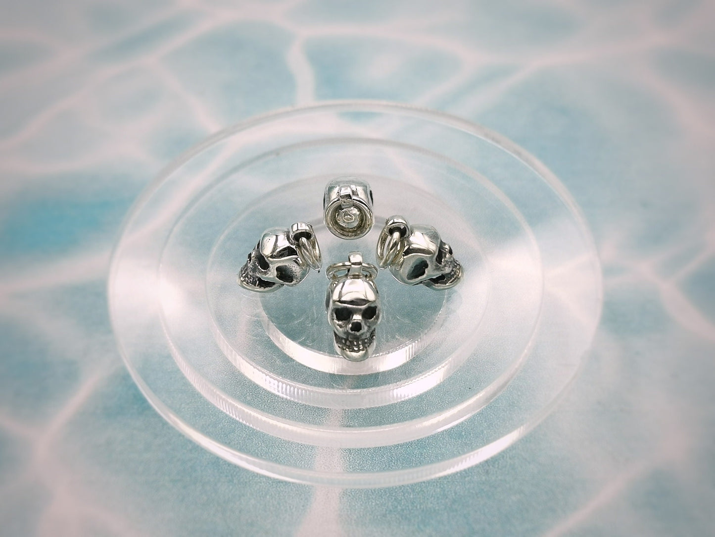 Sterling silver skull attachments for clicker rings, handmade at Tribal. This listing is for one silver skull not a pair. Ring not included.